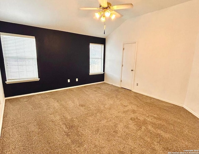 6050 Lakefront, San Antonio, TX 78222 - carpeted spare room featuring lofted ceiling, ceiling fan, and baseboards