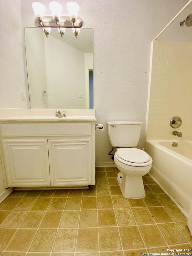 6050 Lakefront, San Antonio, TX 78222 - full bathroom featuring toilet, bathtub / shower combination, vanity, a chandelier, and tile patterned flooring
