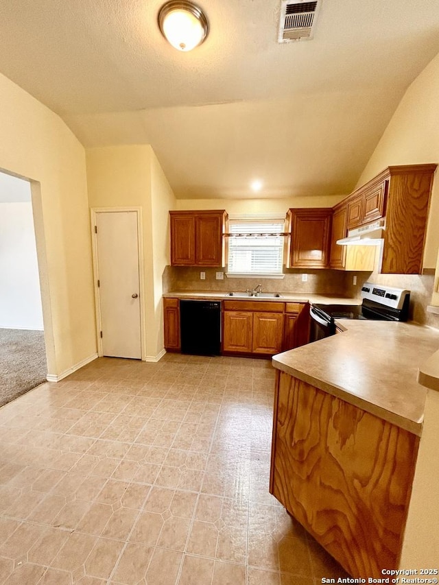 6050 Lakefront, San Antonio, TX 78222 - kitchen featuring dishwasher, stainless steel range with electric stovetop, vaulted ceiling, backsplash, and light countertops