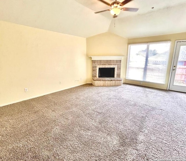 6050 Lakefront, San Antonio, TX 78222 - unfurnished living room featuring lofted ceiling, carpet, a ceiling fan, a fireplace, and baseboards