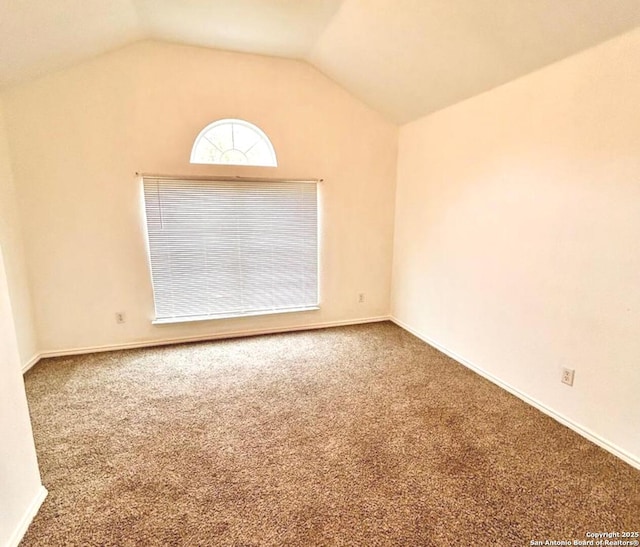 6050 Lakefront, San Antonio, TX 78222 - carpeted empty room with vaulted ceiling and baseboards