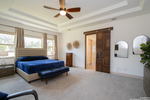 bedroom with light carpet, a barn door, a raised ceiling, and ceiling fan