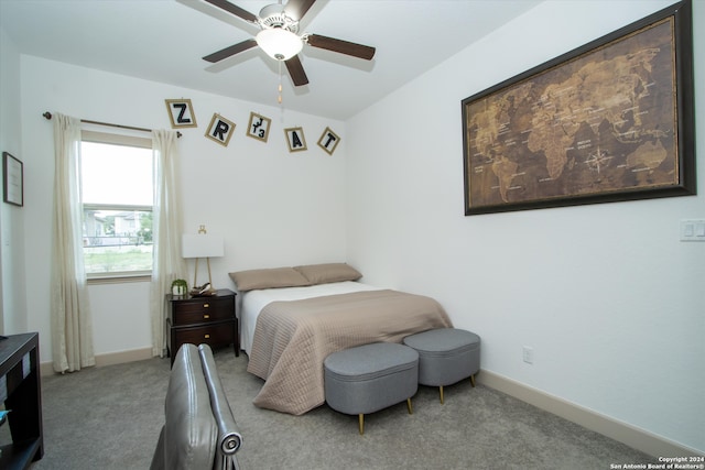 bedroom featuring ceiling fan and light colored carpet