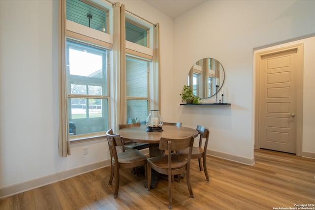 dining area with light hardwood / wood-style flooring