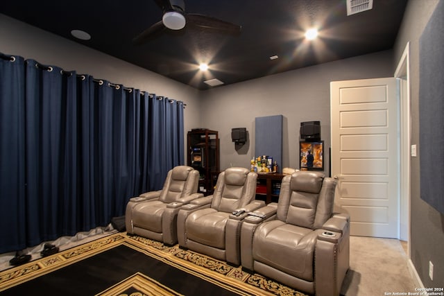 home theater room with light carpet and ceiling fan