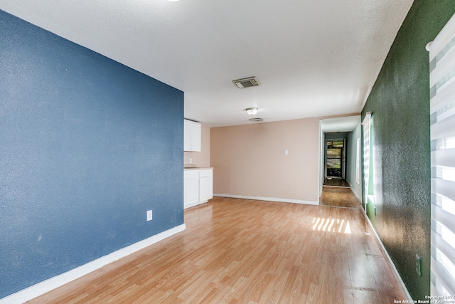 unfurnished room featuring light wood-type flooring