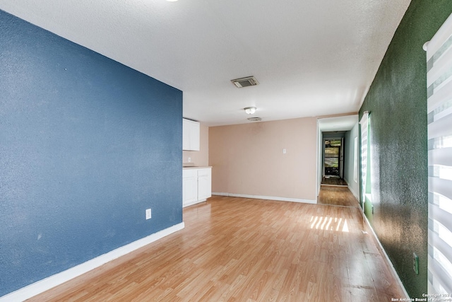 125 Forrest Ave, San Antonio, TX 78204 - unfurnished room with light wood finished floors and baseboards