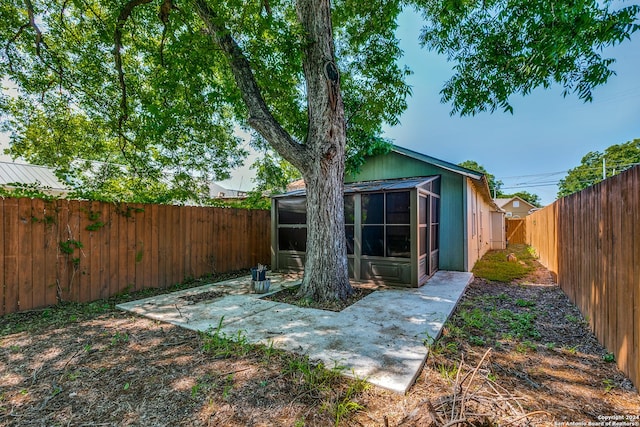 125 Forrest Ave, San Antonio, TX 78204 - fenced backyard with a sunroom and a patio area