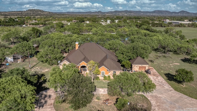 birds eye view of property with a mountain view