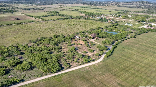 drone / aerial view with a rural view and a water view