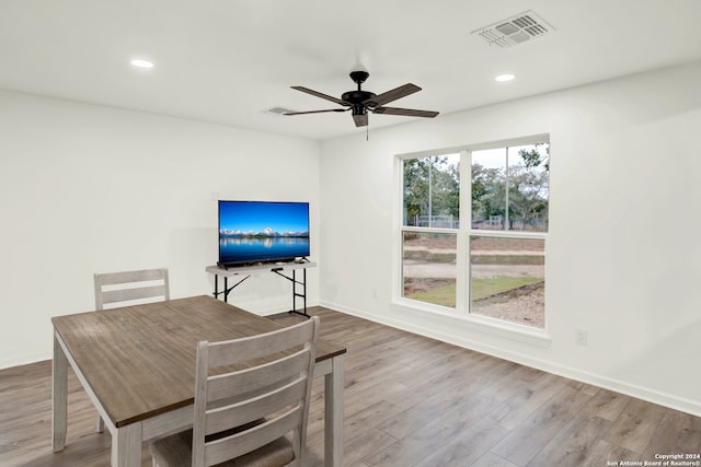 unfurnished dining area with hardwood / wood-style flooring and ceiling fan