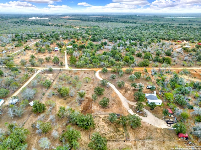 birds eye view of property with a rural view