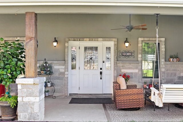 property entrance with ceiling fan