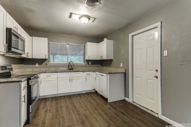 kitchen with white cabinetry, dark wood-type flooring, a textured ceiling, and appliances with stainless steel finishes