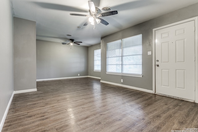 foyer featuring ceiling fan and dark wood-type flooring