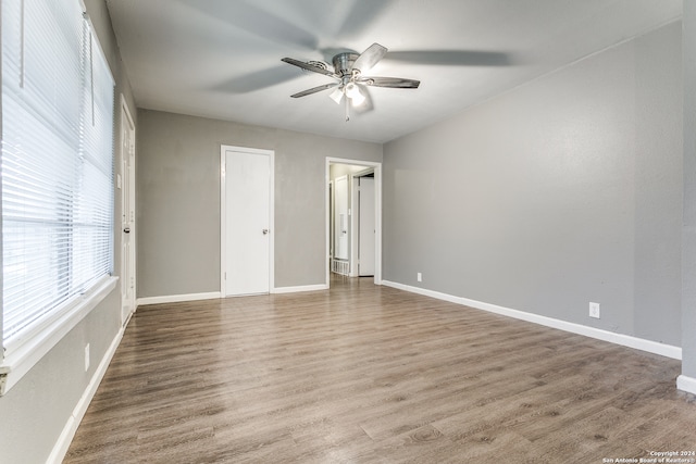 unfurnished bedroom with wood-type flooring and ceiling fan