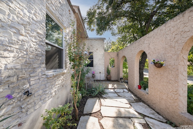 view of side of home with a patio