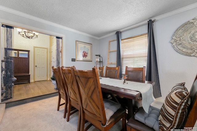 dining area with crown molding, light carpet, a textured ceiling, and an inviting chandelier