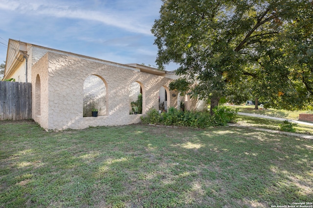 view of property exterior featuring a yard