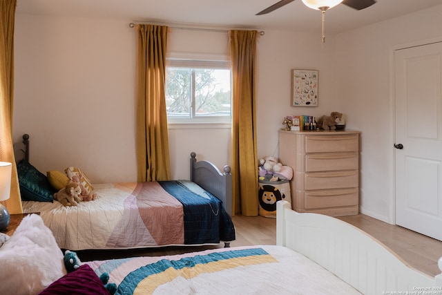 bedroom featuring light hardwood / wood-style floors and ceiling fan