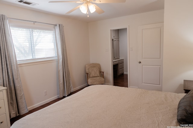 bedroom with ceiling fan and dark hardwood / wood-style floors