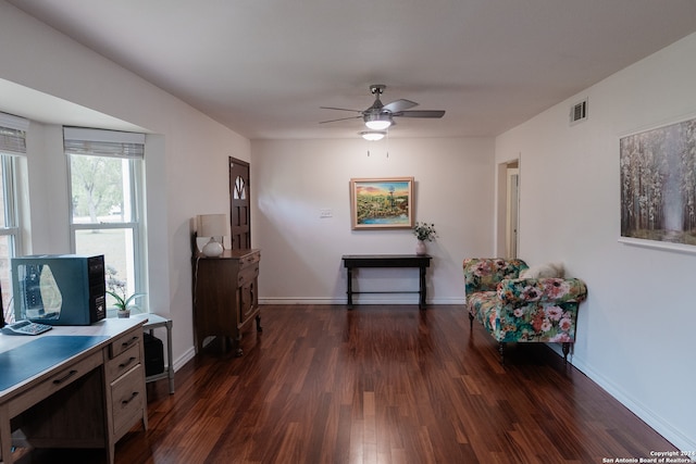 sitting room with ceiling fan and dark hardwood / wood-style flooring