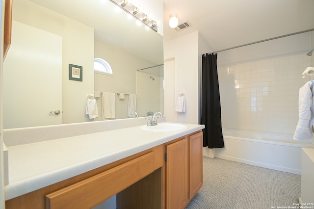 bathroom featuring vanity and shower / bath combination with curtain