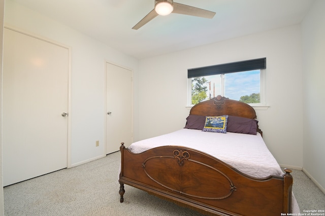 carpeted bedroom with ceiling fan