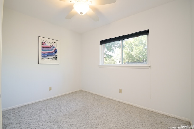 empty room with carpet flooring and ceiling fan