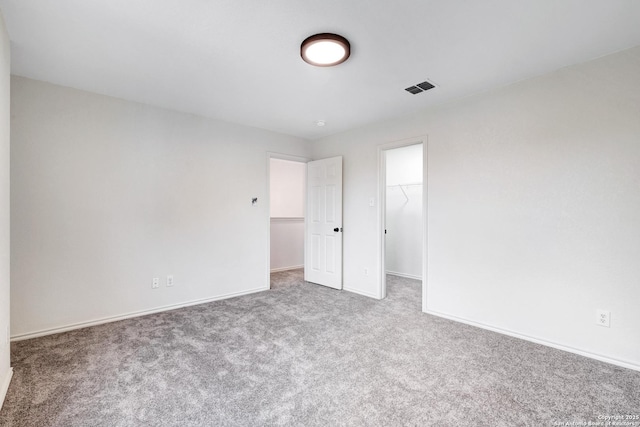 unfurnished room featuring carpet flooring