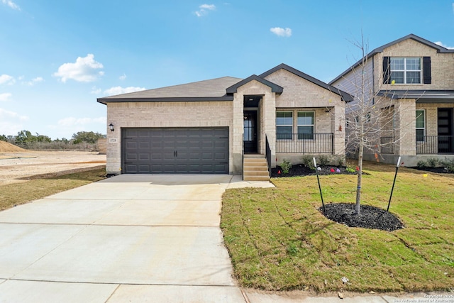 5728 Sendero Rnch, San Antonio, TX 78253 - view of front facade with an attached garage, driveway, brick siding, and a front yard