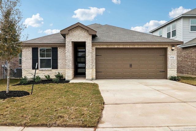 5715 Sendero Rnch, San Antonio, TX 78253 - view of front of house with a shingled roof, a garage, stone siding, a front yard, and driveway