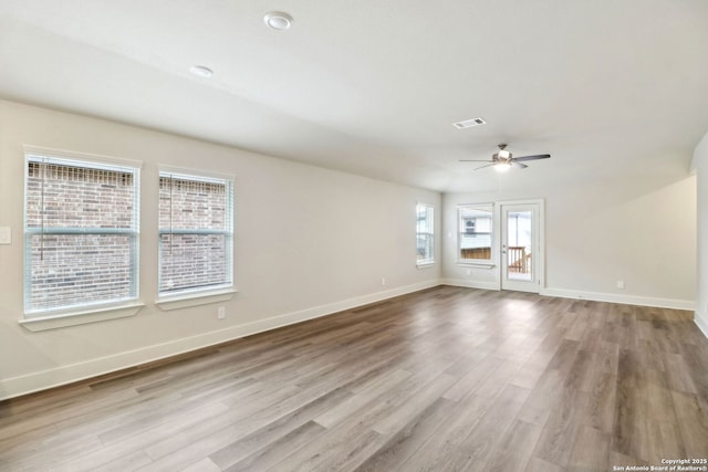 spare room with ceiling fan and light hardwood / wood-style flooring