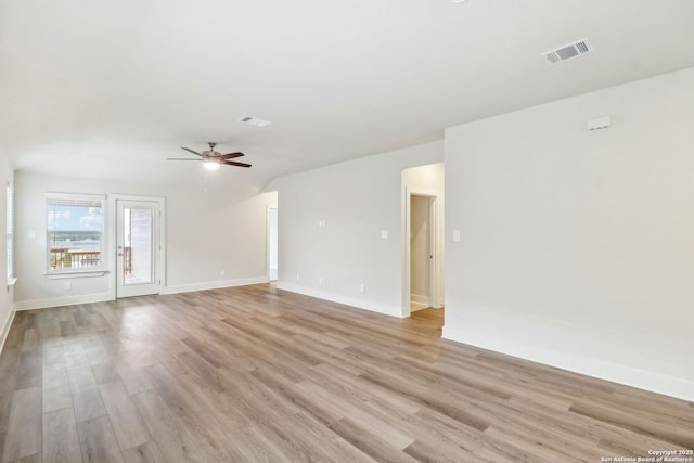 unfurnished room with ceiling fan and light hardwood / wood-style floors