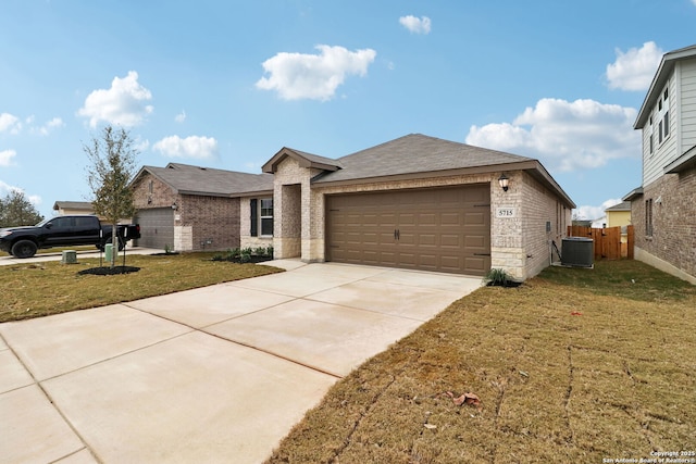 5715 Sendero Rnch, San Antonio, TX 78253 - ranch-style home with brick siding, central air condition unit, an attached garage, concrete driveway, and roof with shingles