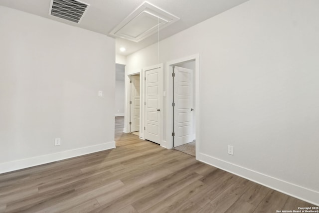 unfurnished bedroom featuring hardwood / wood-style flooring