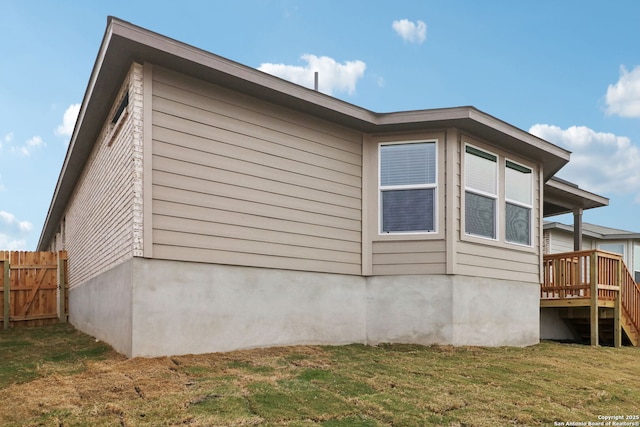 view of property exterior with a yard