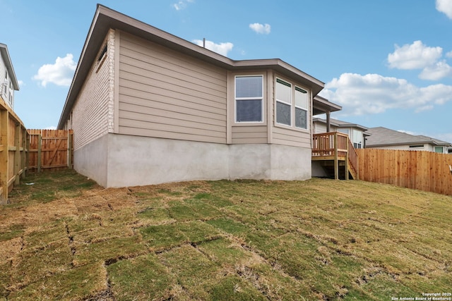 rear view of property with a lawn