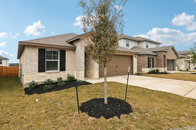 view of front facade with a garage and a front lawn