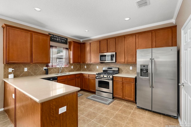 kitchen with decorative backsplash, kitchen peninsula, ornamental molding, stainless steel appliances, and sink