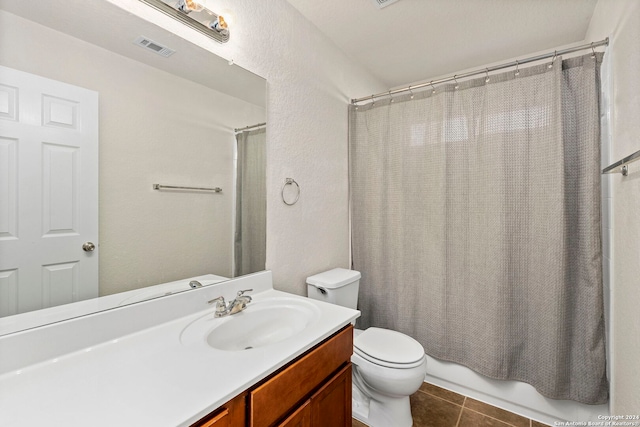 full bathroom with toilet, vanity, tile patterned floors, and shower / bath combo with shower curtain