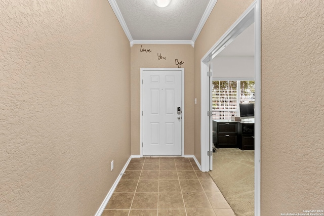 doorway to outside featuring a textured ceiling and ornamental molding