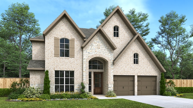 view of front facade with a garage and a front lawn