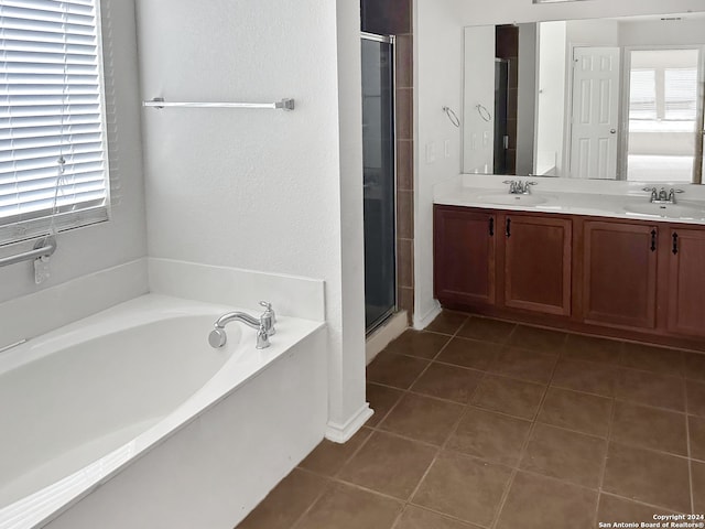 bathroom featuring tile patterned flooring, vanity, and independent shower and bath