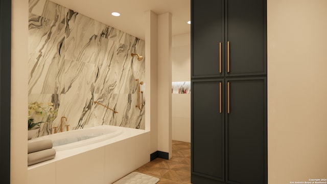 bathroom featuring tiled tub and parquet floors