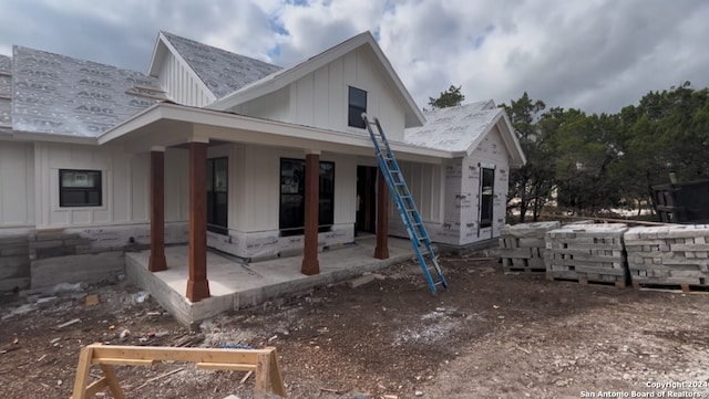 back of property with a patio