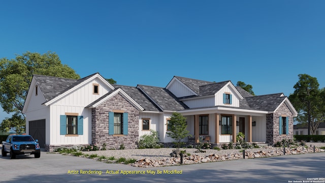 view of front of property with a garage and covered porch