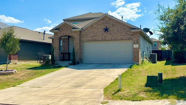 view of front of house with a front yard, a garage, and cooling unit