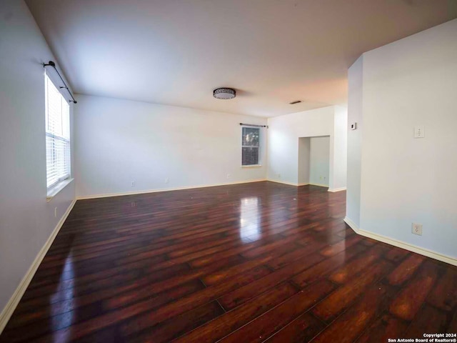 unfurnished room featuring dark hardwood / wood-style floors