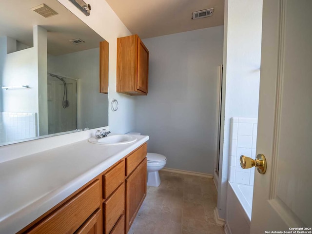 full bathroom featuring vanity, toilet, and shower with separate bathtub